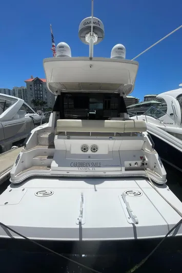 Caribbean Smile Yacht Photos Pics 2019 Regal 42 Grande Coupe yacht docked, rear view.
