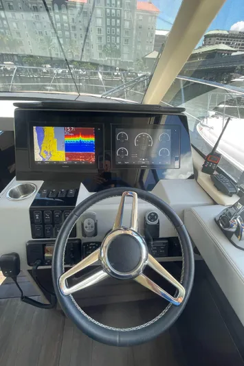 Caribbean Smile Yacht Photos Pics 2019 Regal 42 Grande Coupe yacht helm with advanced navigation displays.