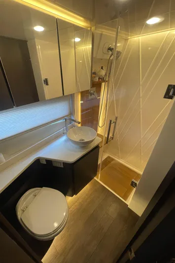 Caribbean Smile Yacht Photos Pics Modern bathroom in 2019 Regal 42 Grande Coupe yacht with shower, sink, and toilet.