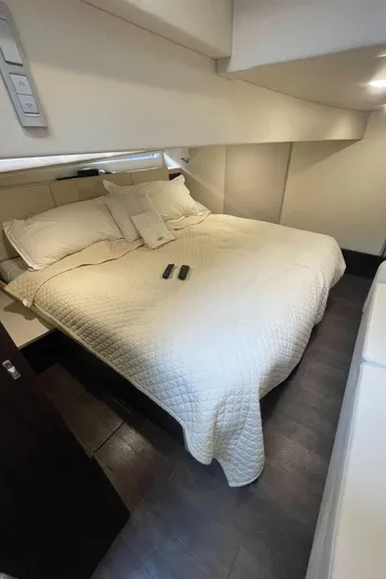 Caribbean Smile Yacht Photos Pics Luxurious bedroom in 2019 Regal 42 Grande Coupe yacht with cozy bedding.