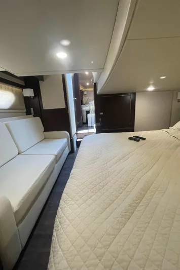 Caribbean Smile Yacht Photos Pics Interior of 2019 Regal 42 Grande Coupe yacht with bed and sofa.