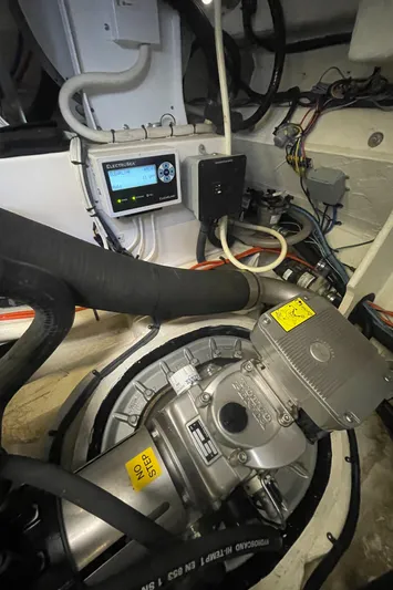 Caribbean Smile Yacht Photos Pics Engine room of a 2019 Regal 42 Grande Coupe yacht with mechanical components.