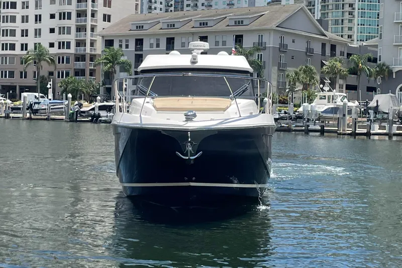 Caribbean Smile Yacht Photos Pics 2019 Regal 42 Grande Coupe yacht docked in a marina.