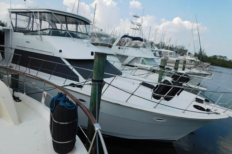 Driftwood Yacht Photos Pics Luxury 1995 Jefferson 52 Riviana Cockpit MY yacht docked at marina.