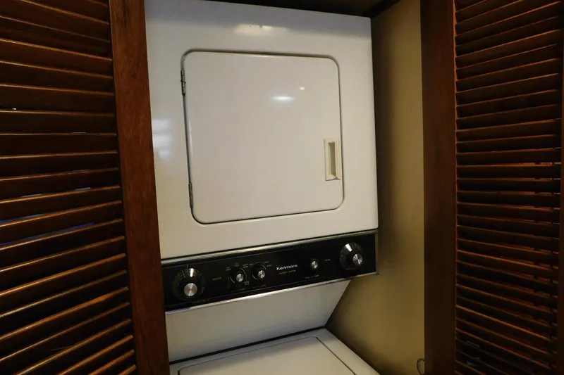 Driftwood Yacht Photos Pics Laundry area with a Kenmore dryer inside a 1995 Jefferson 52 Riviana Cockpit MY.