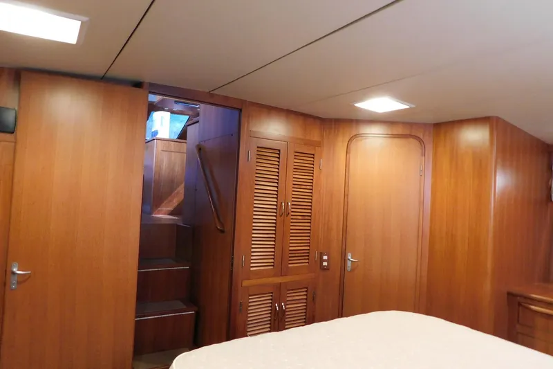 Driftwood Yacht Photos Pics Interior of 1995 Jefferson 52 Riviana Cockpit MY with wooden paneling and staircase.