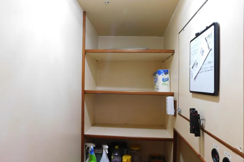 Driftwood Yacht Photos Pics Storage shelves in a 1995 Jefferson 52 Riviana Cockpit MY boat interior.