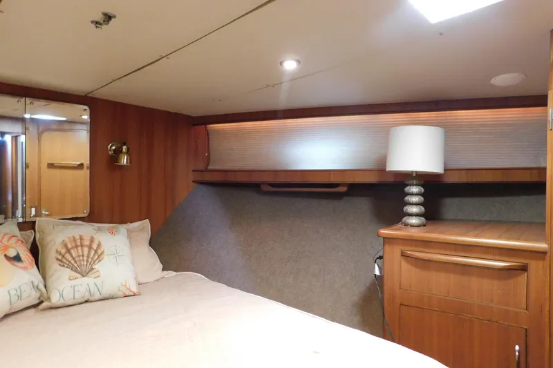 Driftwood Yacht Photos Pics Cozy bedroom interior of 1995 Jefferson 52 Riviana Cockpit MY yacht with nautical decor.