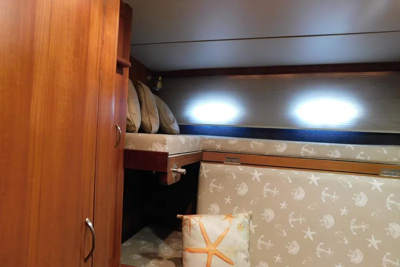 Driftwood Yacht Photos Pics Cozy cabin interior of 1995 Jefferson 52 Riviana Cockpit MY with nautical-themed decor.