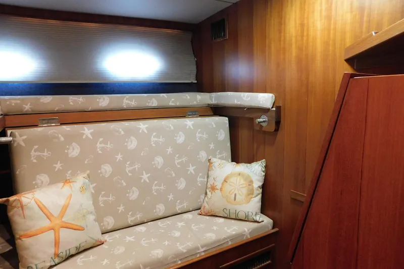 Driftwood Yacht Photos Pics Interior of 1995 Jefferson 52 Riviana Cockpit MY with nautical-themed cushions.