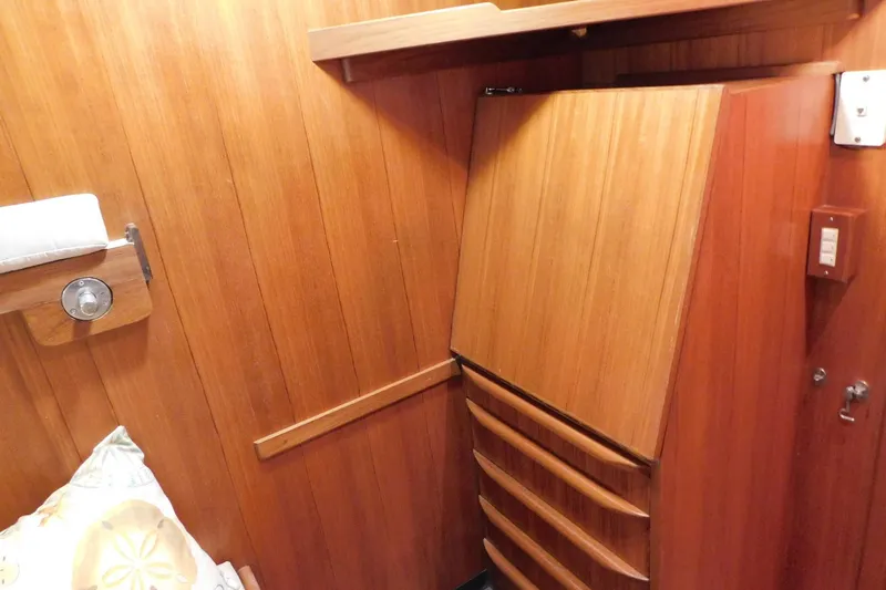 Driftwood Yacht Photos Pics Wood-paneled interior of 1995 Jefferson 52 Riviana Cockpit MY with built-in storage.