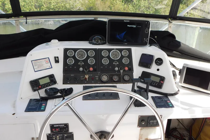 Driftwood Yacht Photos Pics Cockpit of 1995 Jefferson 52 Riviana MY with navigation instruments and steering wheel.