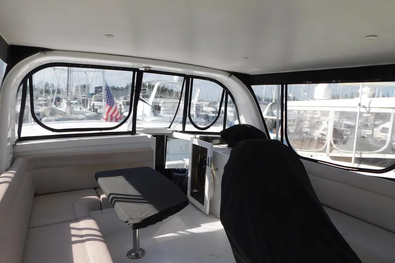 Driftwood Yacht Photos Pics Interior of 1995 Jefferson 52 Riviana Cockpit MY yacht with seating and table.