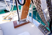 Deck of a 2016 Custom Trawler with ropes and polished wood details.