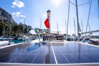 Custom 2016 Trawler with solar panels docked in a sunny marina.
