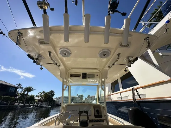T/t Living With E's Yacht Photos Pics 2018 Scout 255LXF boat interior with fishing rod holders and electronics.