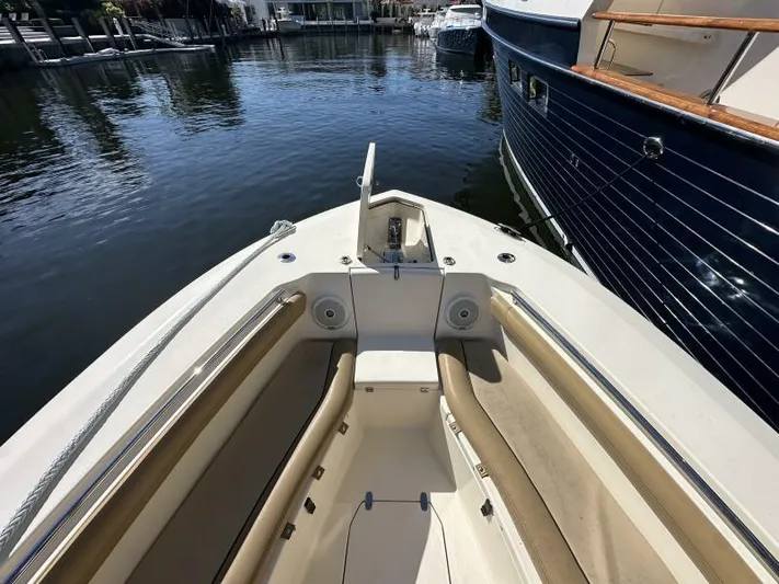 T/t Living With E's Yacht Photos Pics 2018 Scout 255LXF boat bow with seating, docked in marina.