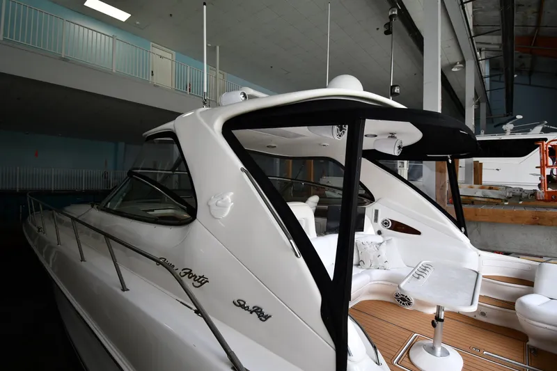  Yacht Photos Pics 2001 Sea Ray 540 Sundancer yacht in indoor storage, showcasing sleek design and luxury features.