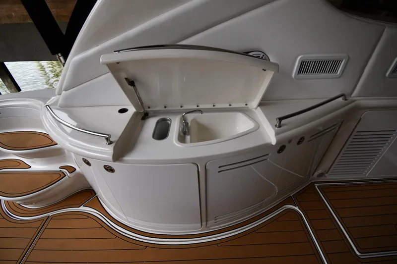  Yacht Photos Pics 2001 Sea Ray 540 Sundancer yacht interior with sink and teak flooring.