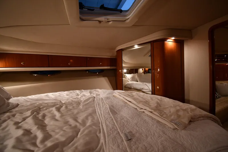  Yacht Photos Pics Luxurious cabin interior of 2001 Sea Ray 540 Sundancer yacht with cozy bedding.