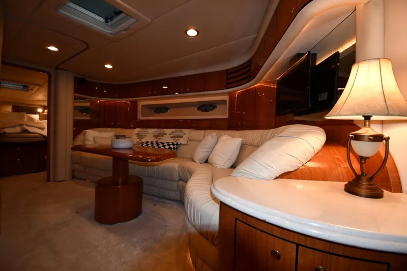  Yacht Photos Pics Luxurious interior of 2001 Sea Ray 540 Sundancer yacht with plush seating and elegant lighting.