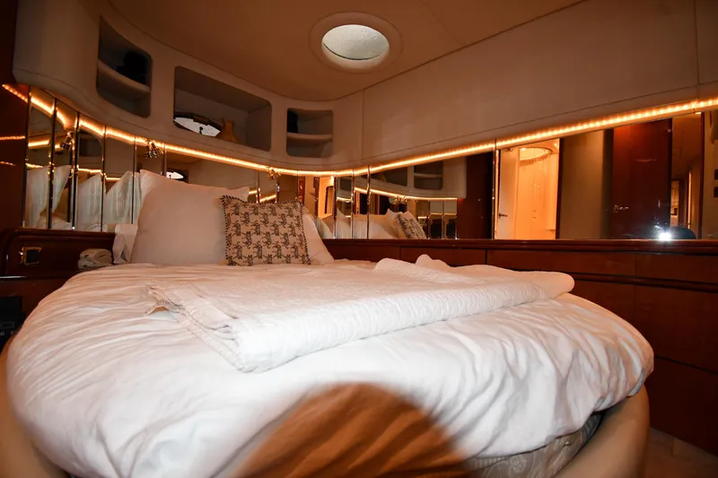  Yacht Photos Pics Luxurious bedroom interior of 2001 Sea Ray 540 Sundancer yacht with elegant bedding.