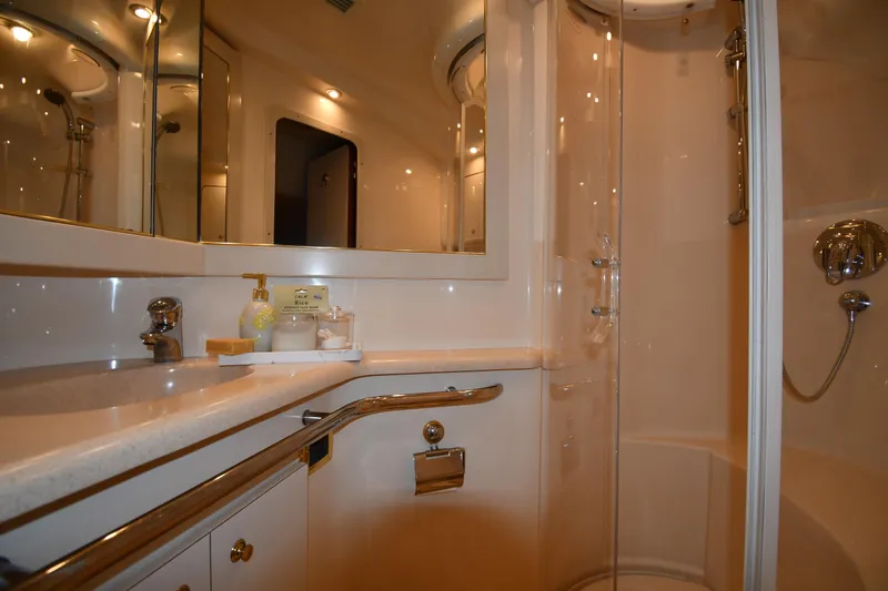  Yacht Photos Pics Luxurious bathroom in 2001 Sea Ray 540 Sundancer yacht with modern fixtures and shower.