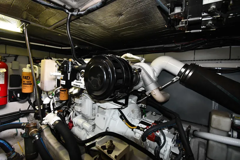  Yacht Photos Pics Engine room of 2001 Sea Ray 540 Sundancer with visible CAT components and fire extinguisher.