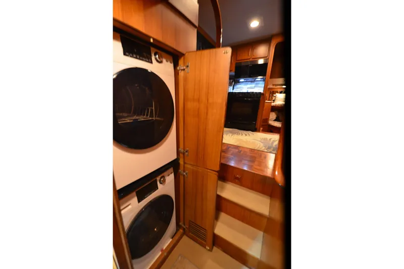  Yacht Photos Pics Laundry area inside 1990 Jefferson 52 Marquessa ED yacht with stacked washer and dryer.