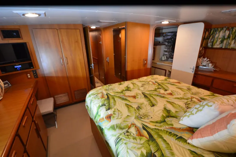 Yacht Photos Pics Luxurious cabin interior of 1990 Jefferson 52 Marquessa ED yacht with tropical bedding.