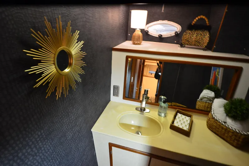  Yacht Photos Pics Luxurious bathroom in 1990 Jefferson 52 Marquessa ED yacht with elegant decor.