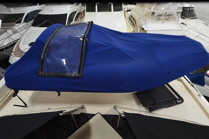  Yacht Photos Pics 1990 Jefferson 52 Marquessa ED yacht with blue cover in marina setting.