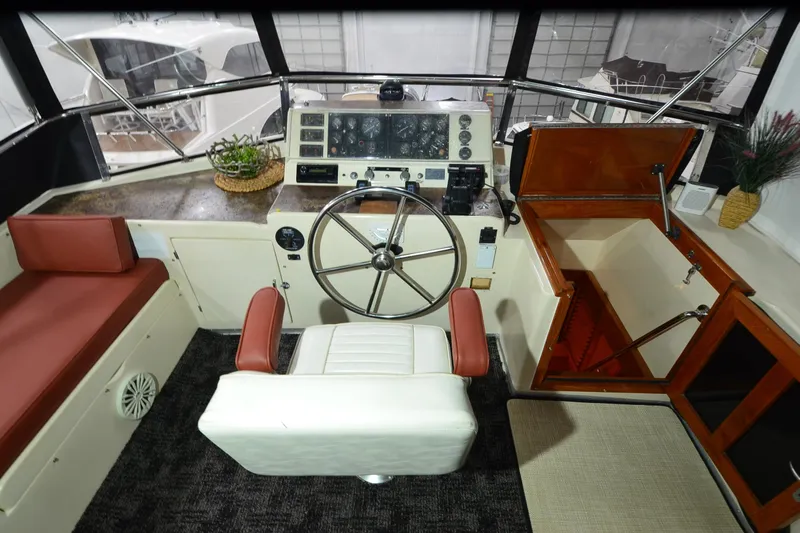  Yacht Photos Pics Cockpit of 1990 Jefferson 52 Marquessa ED yacht with steering wheel and seating.