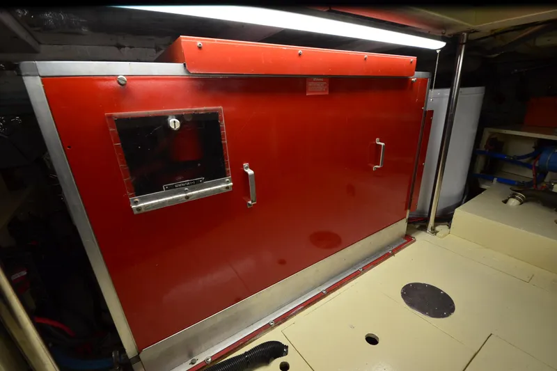  Yacht Photos Pics Engine room of 1990 Jefferson 52 Marquessa ED with red generator enclosure.