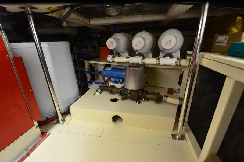  Yacht Photos Pics Engine room of 1990 Jefferson 52 Marquessa ED yacht, featuring mechanical equipment and piping.