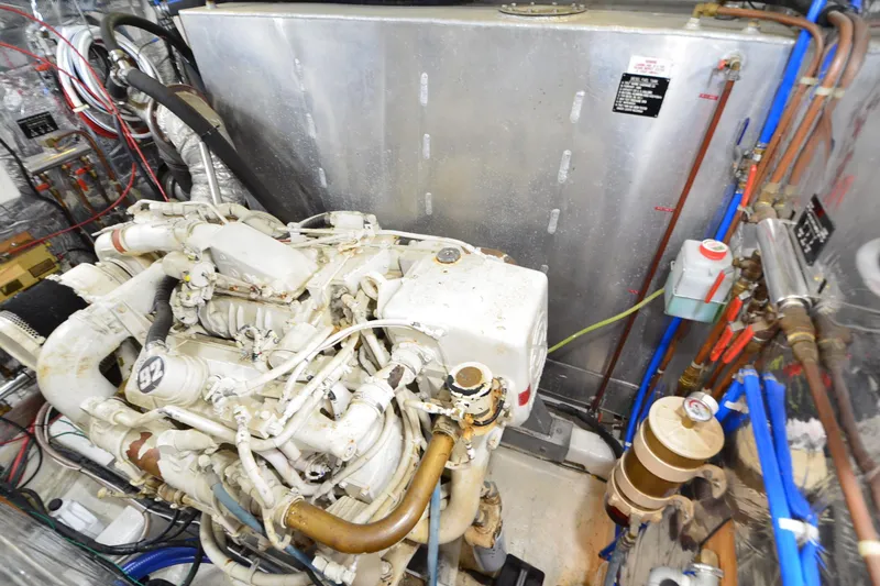  Yacht Photos Pics Engine room of 1990 Jefferson 52 Marquessa ED yacht with visible machinery and components.