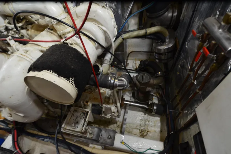  Yacht Photos Pics Engine room of a 1990 Jefferson 52 Marquessa ED yacht, showcasing mechanical components.