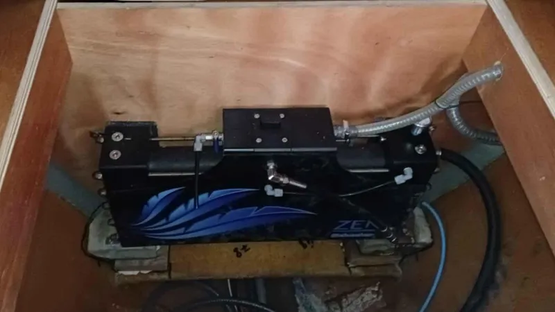 Sunny Days Yacht Photos Pics Battery compartment of a 2013 Lagoon 380 S2 catamaran, featuring wiring and connections.