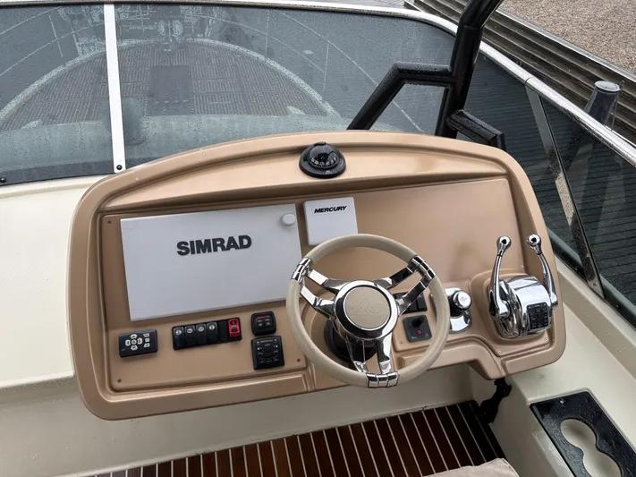  Yacht Photos Pics Helm of 2015 Beneteau Monte Carlo 6 with Simrad navigation system and Mercury controls.