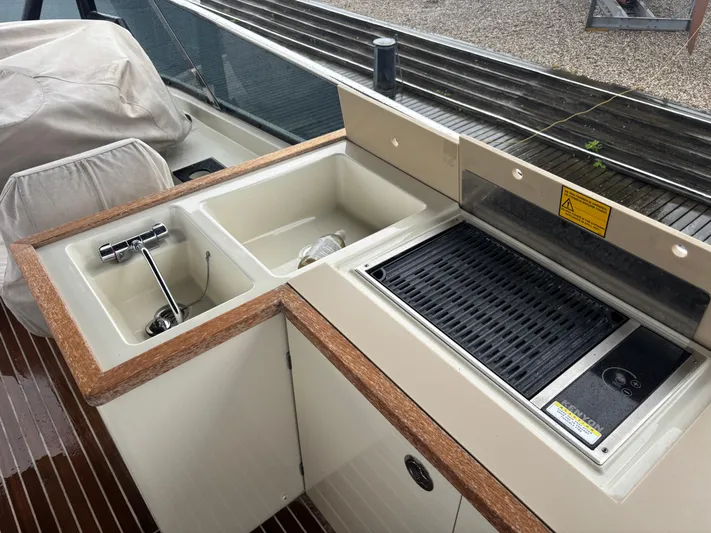  Yacht Photos Pics Outdoor kitchen on 2015 Beneteau Monte Carlo 6 yacht with sink and grill.