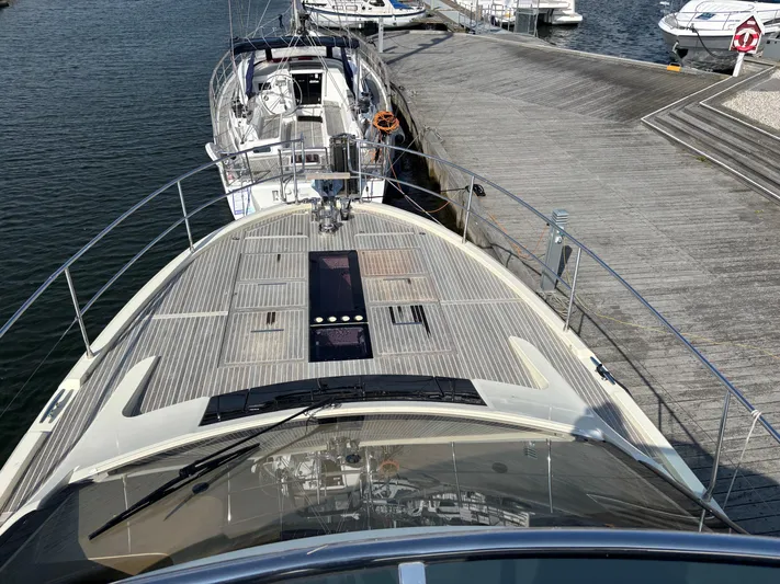  Yacht Photos Pics 2015 Beneteau Monte Carlo 6 yacht docked at marina, view from bow.