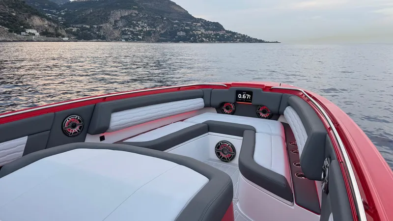 Roman Eagle Yacht Photos Pics 2024 Cigarette 42 Auroris boat interior with luxurious seating, on a scenic coastal waterway.