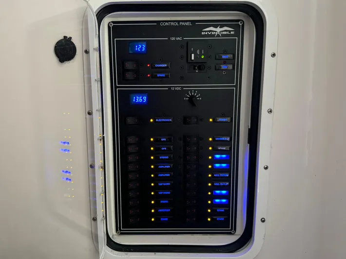  Yacht Photos Pics Control panel of 2020 Invincible 40 Catamaran with illuminated switches and digital displays.