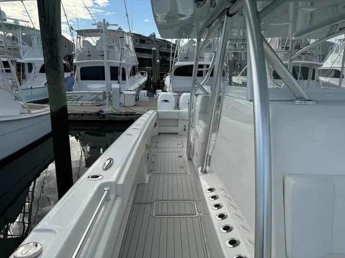  Yacht Photos Pics 2020 Invincible 40 Catamaran docked, showcasing sleek design and spacious deck layout.
