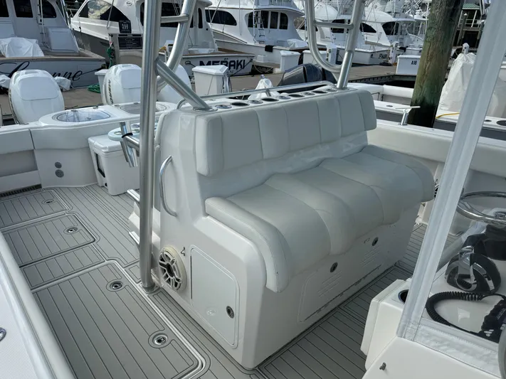  Yacht Photos Pics 2020 Invincible 40 Catamaran interior with white seating and deck, docked at marina.