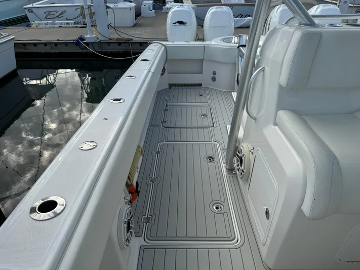  Yacht Photos Pics 2020 Invincible 40 Catamaran interior with sleek deck and seating at marina.