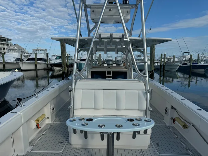  Yacht Photos Pics Invincible 40 Catamaran 2020 at marina, featuring spacious deck and fishing rod holders.