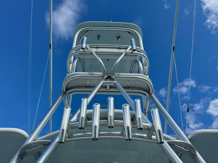  Yacht Photos Pics Invincible 40 Catamaran 2020 tower with rod holders against blue sky.