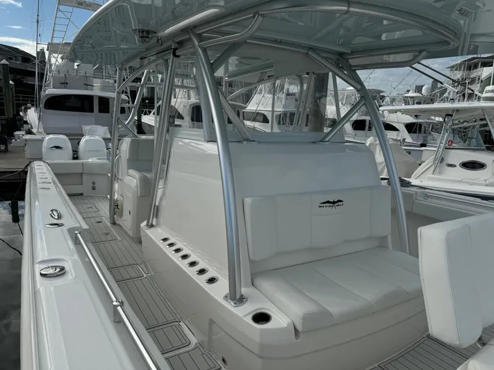  Yacht Photos Pics 2020 Invincible 40 Catamaran with sleek seating and modern design at a marina.