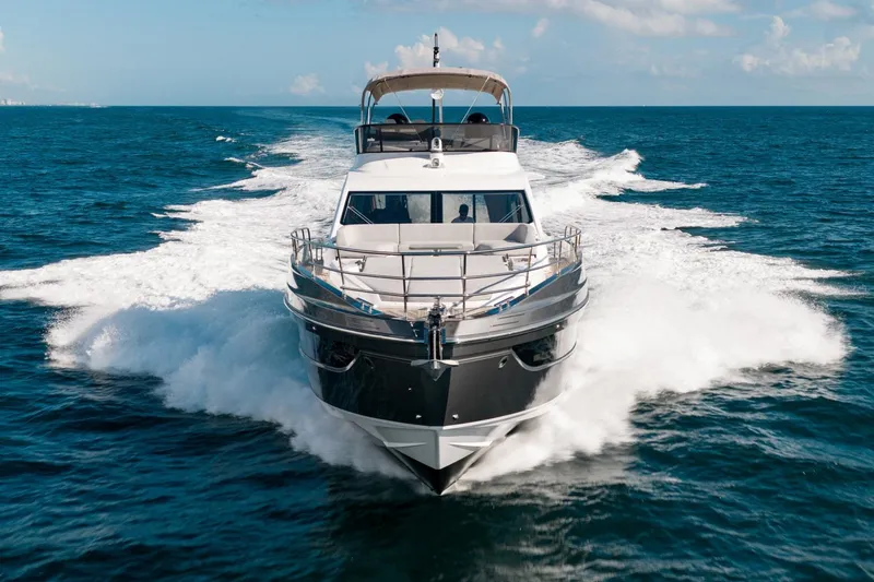 Second Chances Yacht Photos Pics 2024 Azimut S7 yacht cruising on open sea, creating dynamic water splashes.